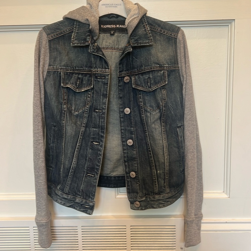 Women’s express jean jacket with grey hood and hoodie material sleeves. Size XS